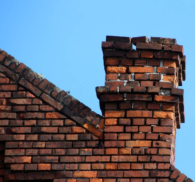 Damaged chimney on an Malibu home showing cracks and missing mortar